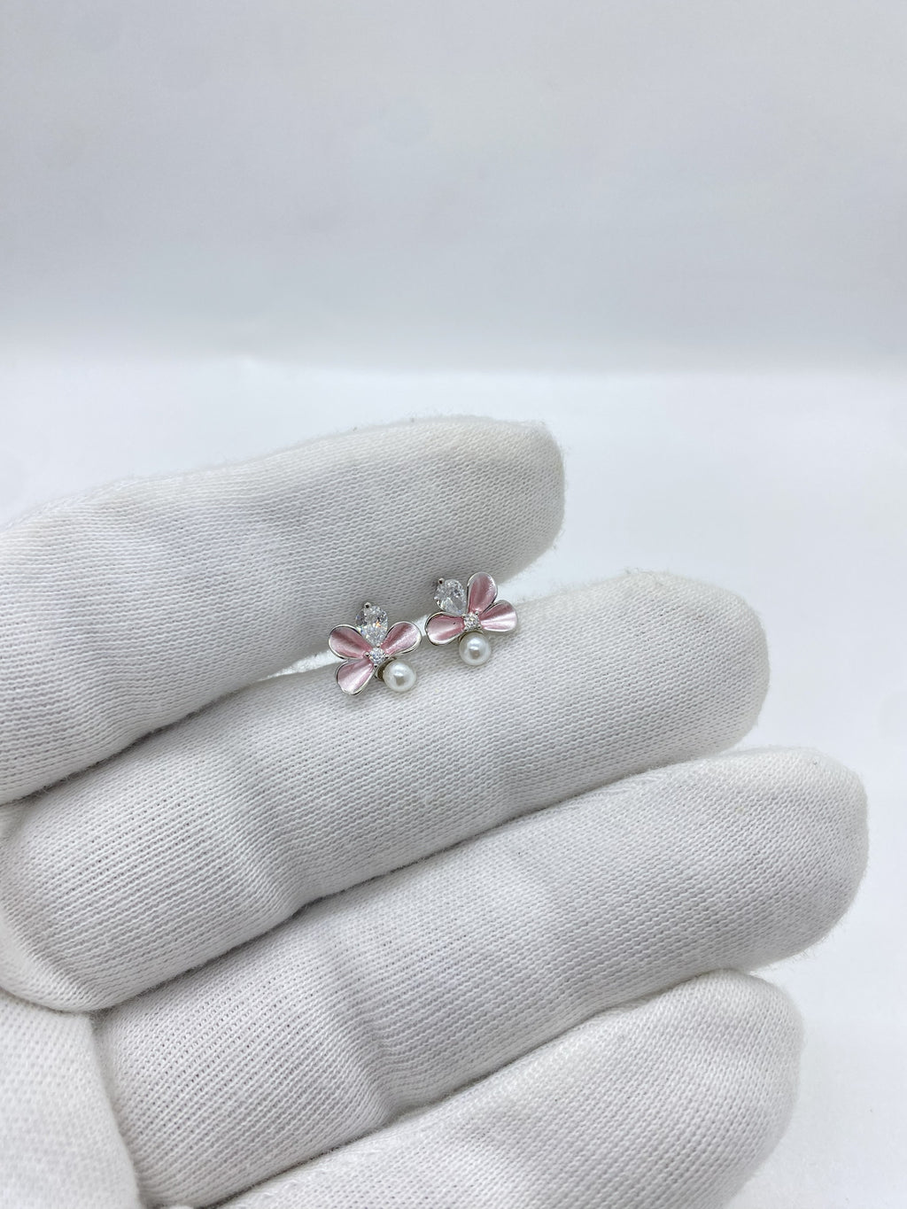 Pink pearl and stone flower earring featuring a graceful floral design