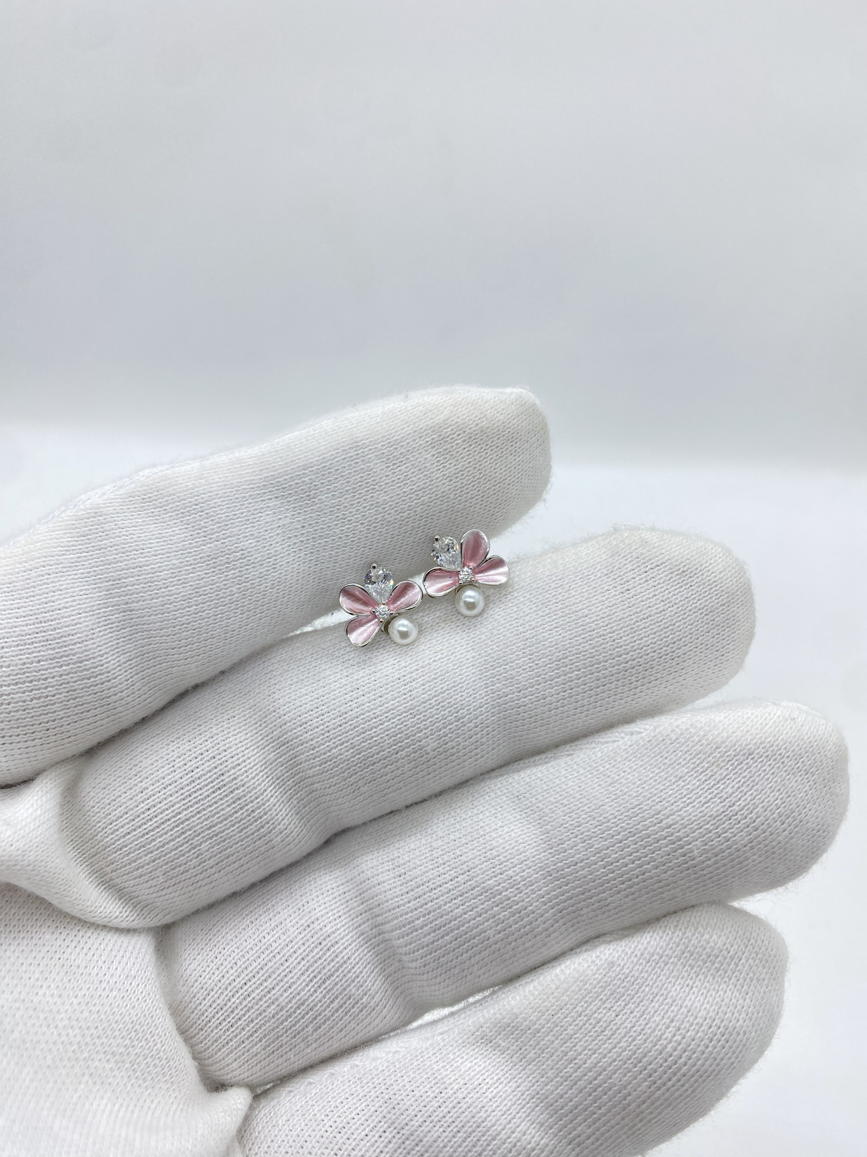 Pink pearl and stone flower earring featuring a graceful floral design