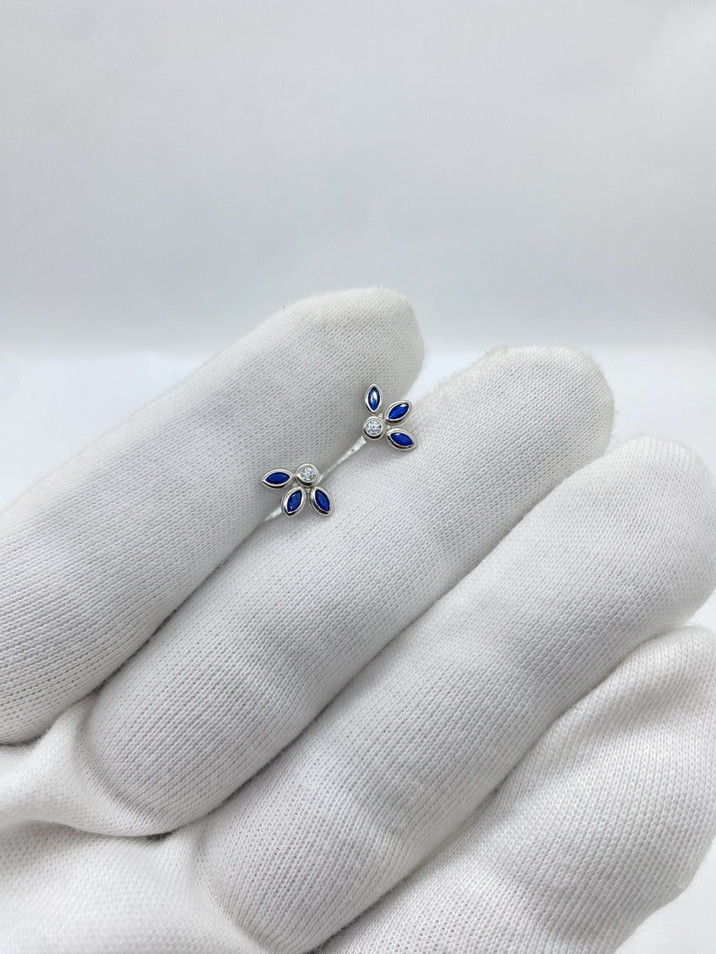 Three blue stone half petals earrings