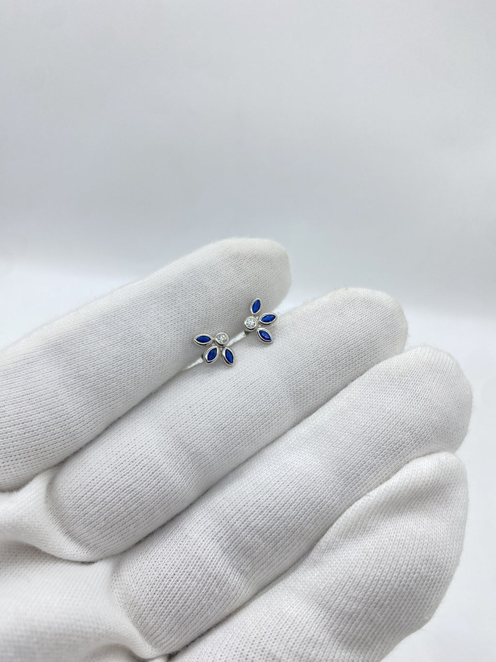 Three blue stone half petals earrings