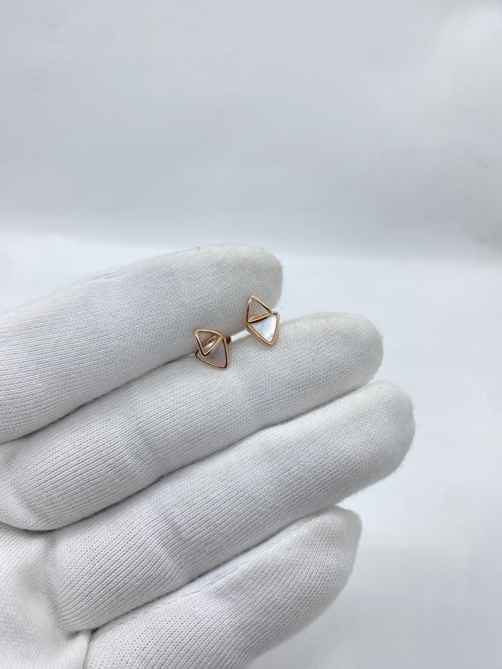 Rose gold triangle-shaped earrings